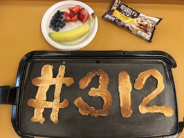 Administrators Cook Pancakes for Staff